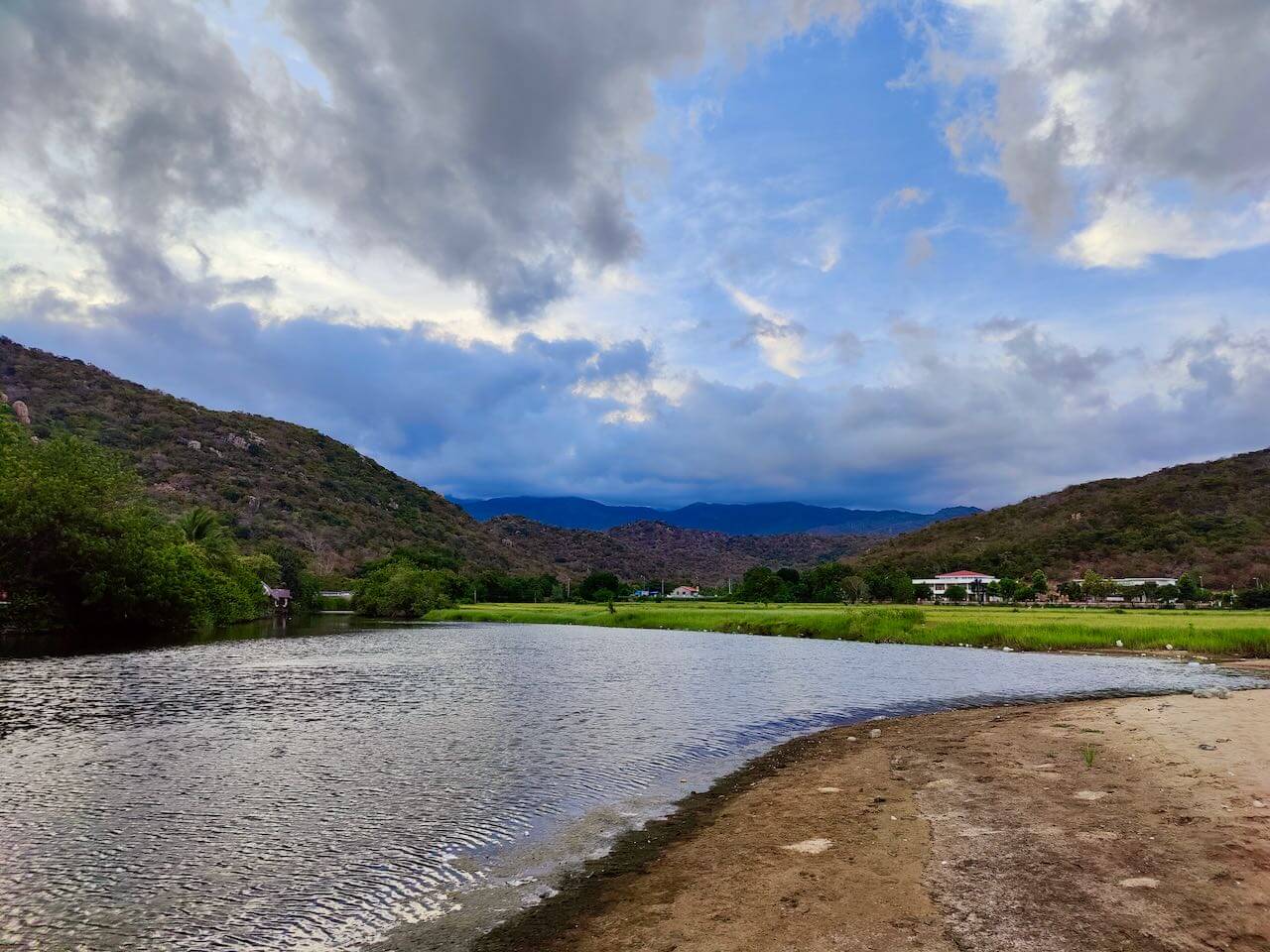 Freshwater Stream Next To Hang Rai with Rice Fields and Mountains