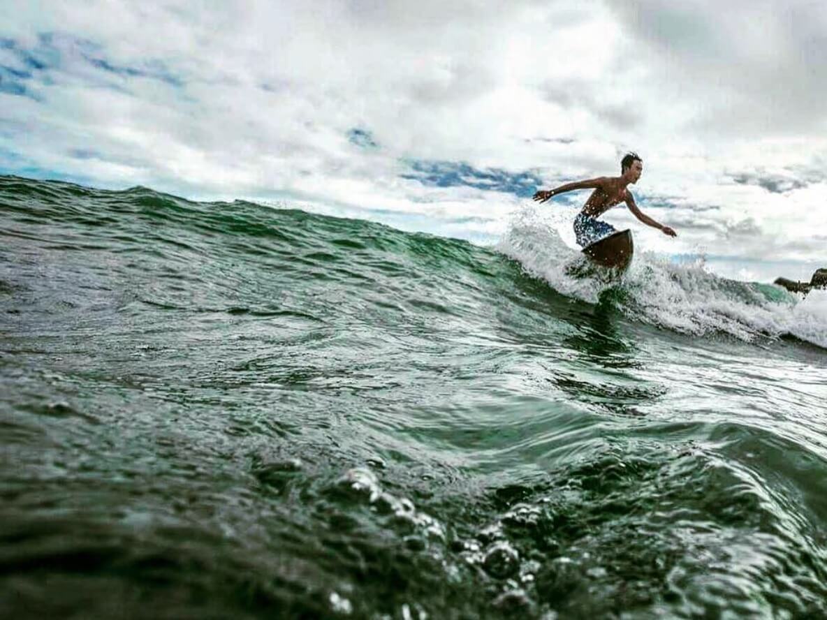 Vietnamese Surfer On Waves